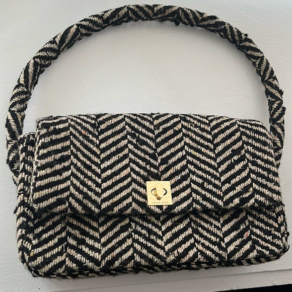 ANINE BING Nico shoulder bag in fishbone patterned black and cream wool